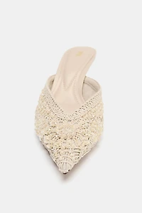 CHAUSSURES OUVERTES À L'ARRIÈRE DÉCORS