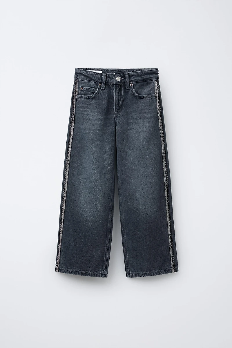 JEANS WIDE LEG À FRANGES ET BRILLANTS