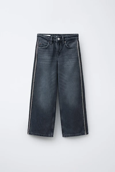 JEANS WIDE LEG À FRANGES ET BRILLANTS