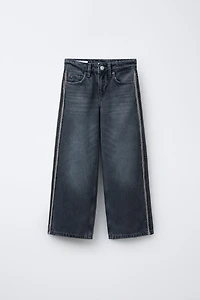 JEANS WIDE LEG À FRANGES ET BRILLANTS