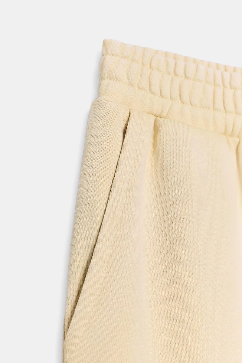 WASHED EFFECT FLEECE PANTS WITH STUDS
