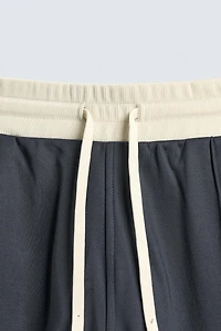 PANTALON DE JOGGING COUPE LARGE AVEC BANDES