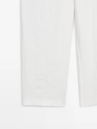 Flowing trousers with buckles