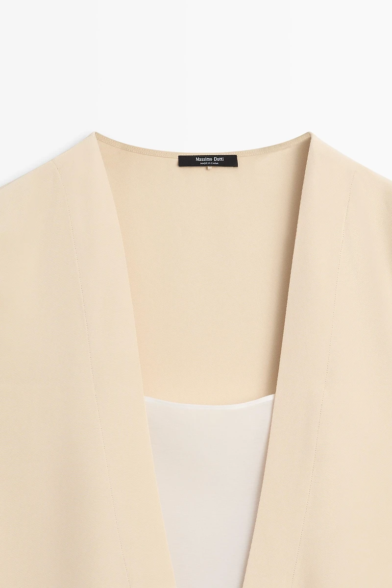 Flowing double-layer top with contrast detail