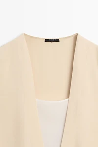 Flowing double-layer top with contrast detail