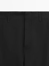 Cotton blend trousers with hem detail