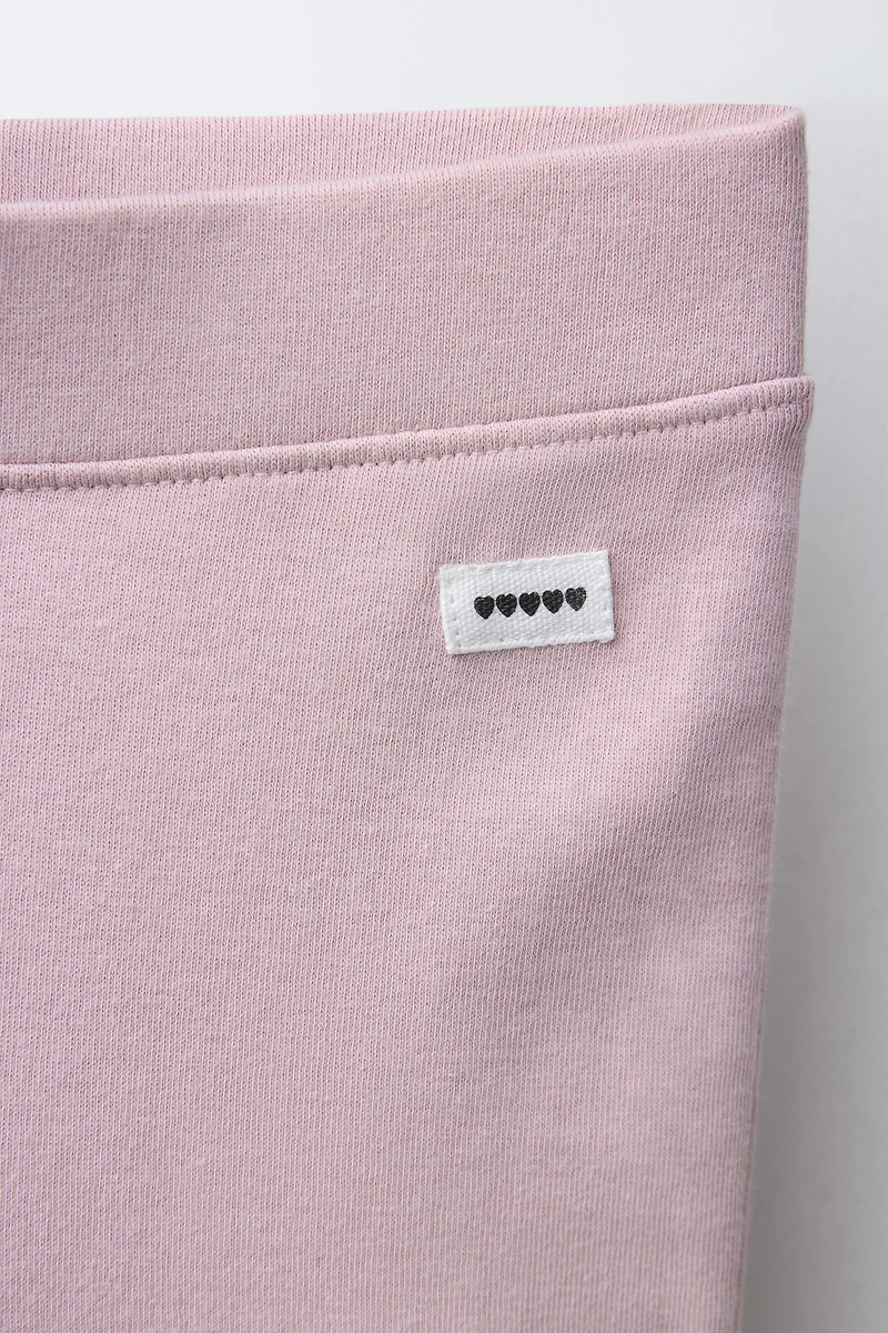 INTERLOCK FLARE LEGGINGS WITH LABEL DETAIL