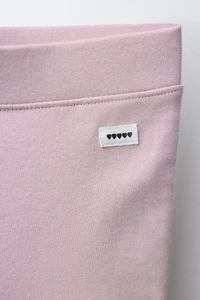 INTERLOCK FLARE LEGGINGS WITH LABEL DETAIL