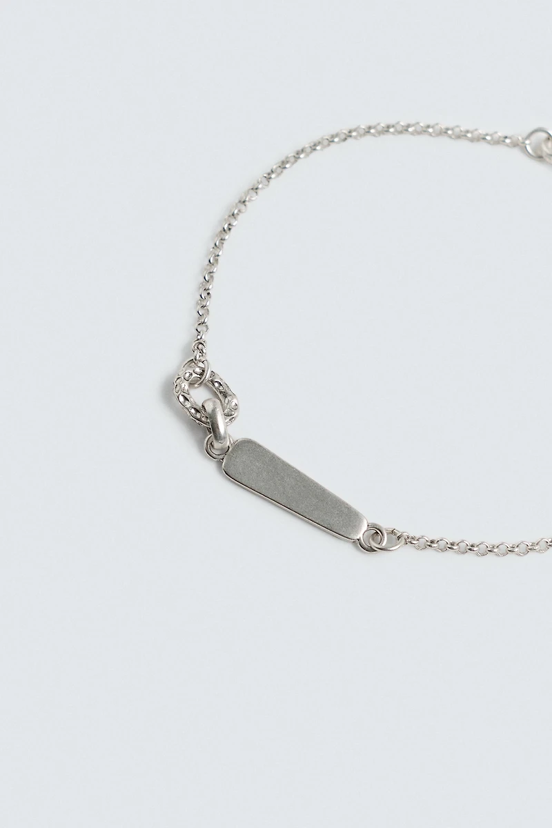 BRACELET À MAILLONS MÉTALLIQUES
