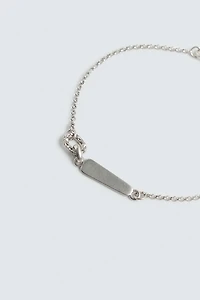 BRACELET À MAILLONS MÉTALLIQUES