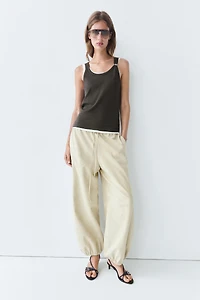 Double-layer strappy top with jewel detail