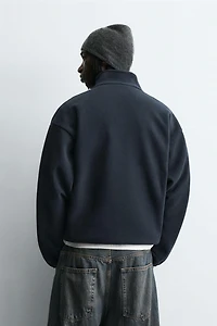 PULL KANGOUROU EFFET MOUTON BRODÉ