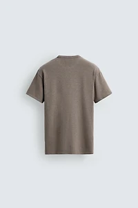 T-SHIRT EN MAILLE LAVÉE À PIÈCES