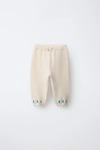 EMBROIDERED FLORAL TEXTURED PANTS WITH LACE TRIM