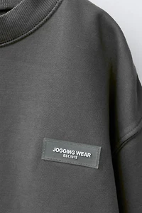 ENSEMBLE SWEAT ET JOGGER CARGO ÉTIQUETTE AUTOCOLLANTE