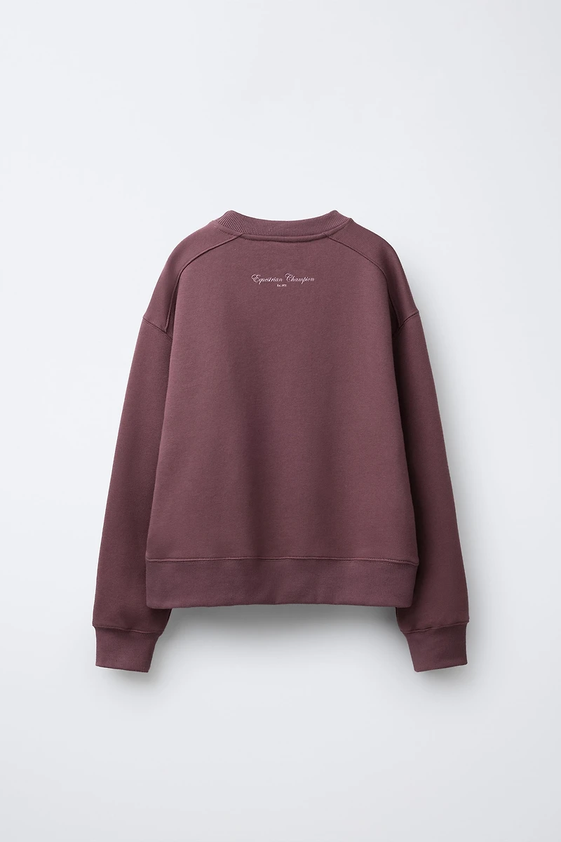 RAISED TEXT SWEATSHIRT