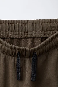 PANTALON SLIM À ZIPS