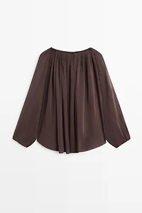 Flowing shirt with gathered details