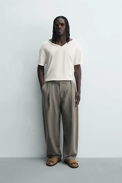 BALLOON FIT PLEATED BELTED PANTS
