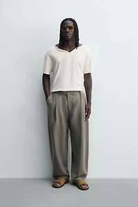 BALLOON FIT PLEATED BELTED PANTS