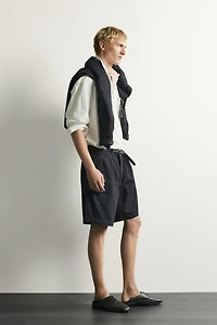 RELAXED FIT PLEATED CHINO DENIM SHORTS