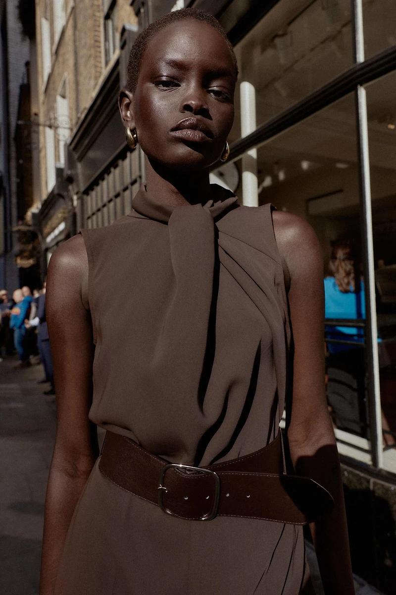 SLEEVELESS BELTED JUMPSUIT