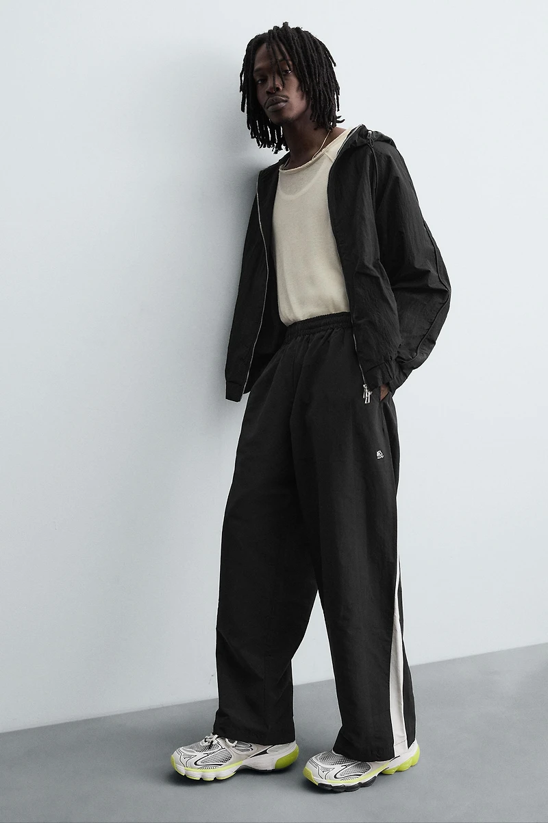 TECHNICAL PANTS WITH STRIPES