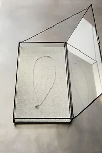 JEWELRY BOX WITH A BLACK METAL BORDER