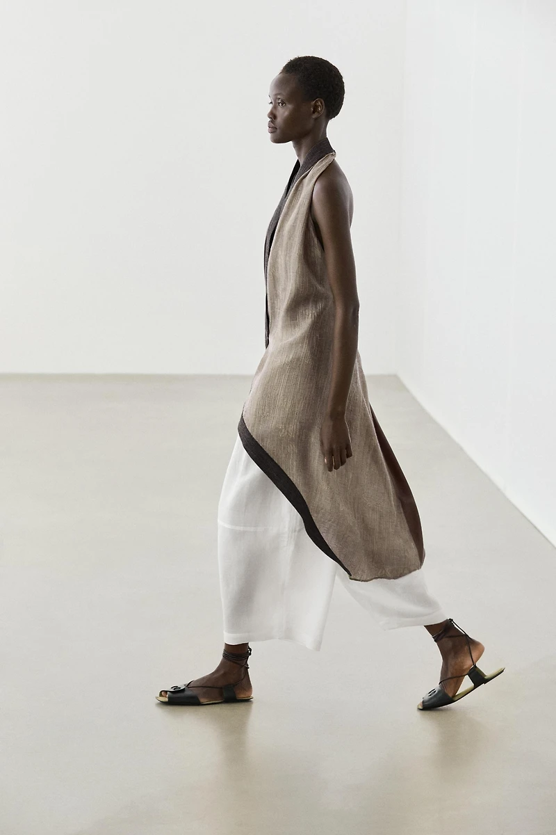 Flowing wrap top with mixed fabric detail