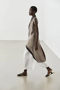 Flowing wrap top with mixed fabric detail