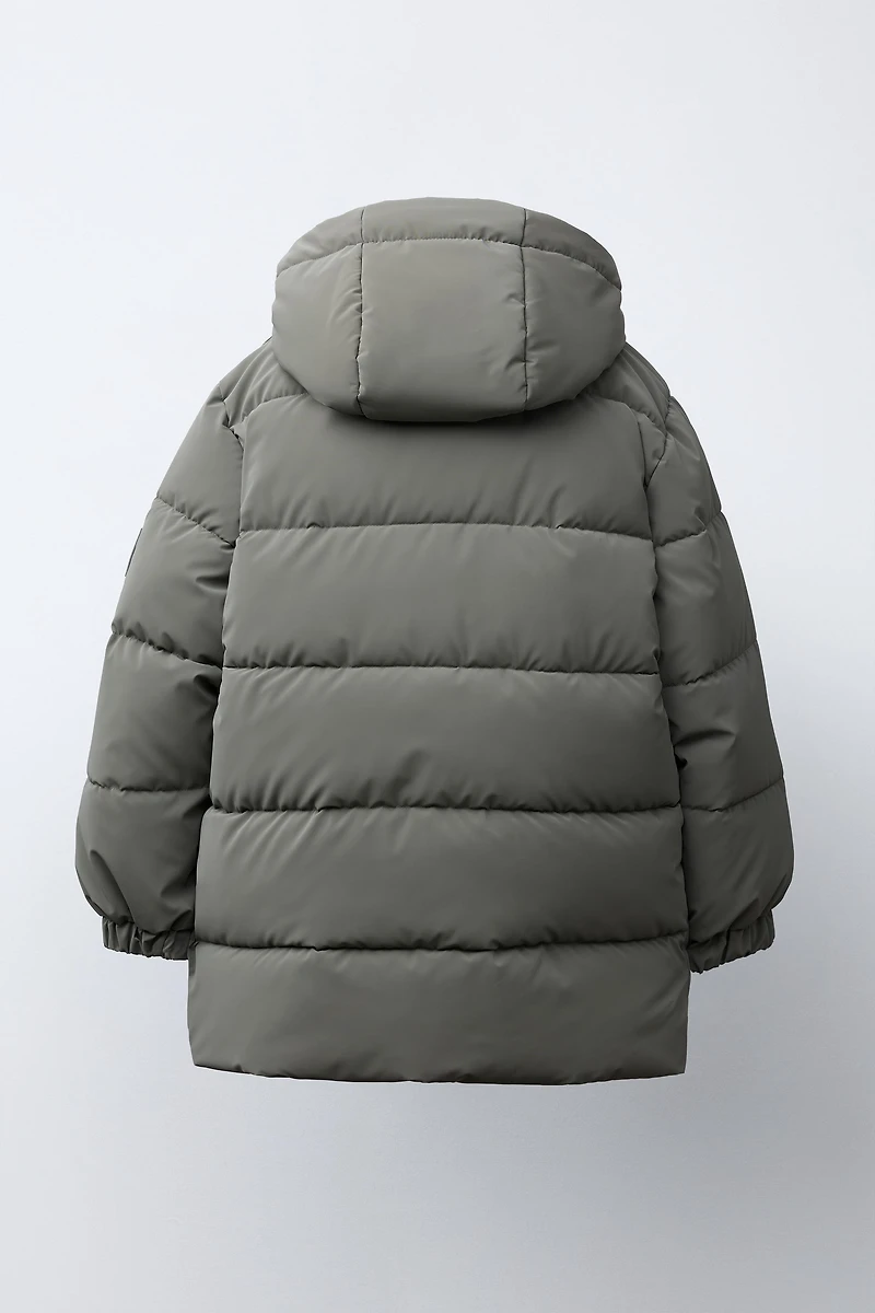 MANTEAU LONG À ÉTIQUETTE GOMMÉE