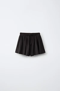 FLOWY GYM SHORTS