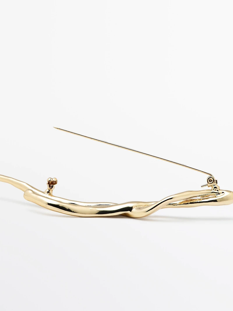 Abstract metal brooch