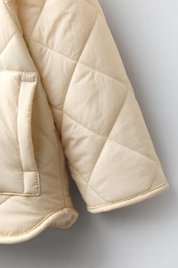 WATER REPELLENT NYLON FAUX SHEARLING JACKET