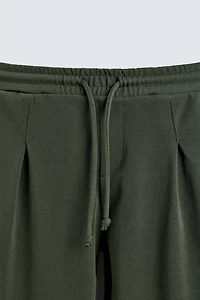 WIDE FIT PLEATED JOGGER PANTS