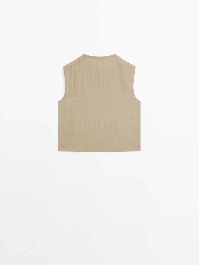 Blouse with silver button fastening on the side