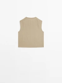 Blouse with silver button fastening on the side