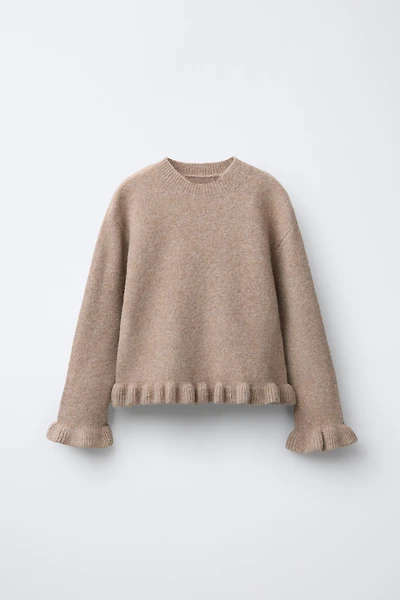 PULL EN MAILLE À VOLANTS