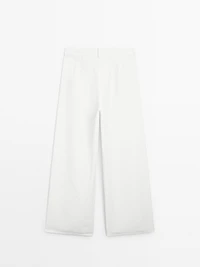 Flowing barrel fit trousers with seam detail