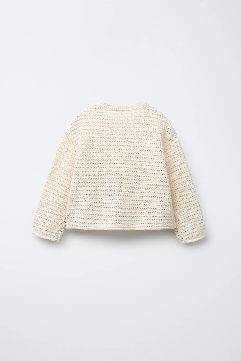 PULL EN MAILLE À FLEURS