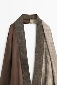 Flowing wrap top with mixed fabric detail