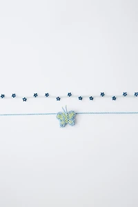PACK OF TWO BUTTERFLY AND FLOWER BEADED NECKLACES