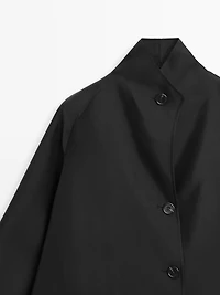 Flowing voluminous cape with button details