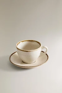 PORCELAIN TEACUP WITH ANTIQUE FINISH RIM