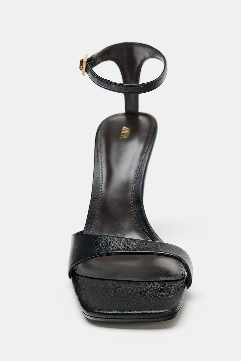 ASYMMETRIC LEATHER HEELED SANDALS