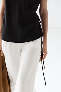 Draped surplice top with corset belt detail
