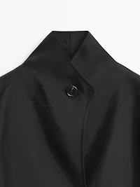 Flowing voluminous cape with button details