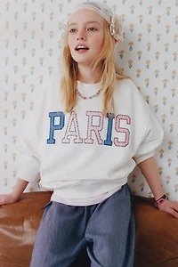 PANTALON BOUFFANT À RAYURES ET LACETS