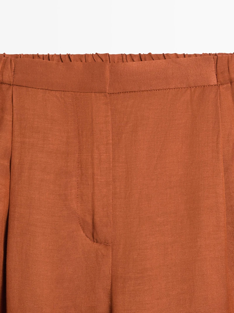 Flowing trousers with tie detail