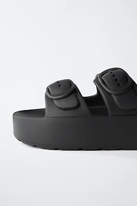 RUBBERIZED BUCKLED SANDALS